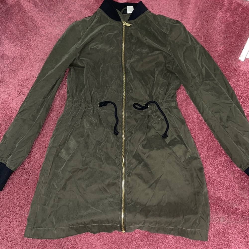 Past hip, long army green jacket, light